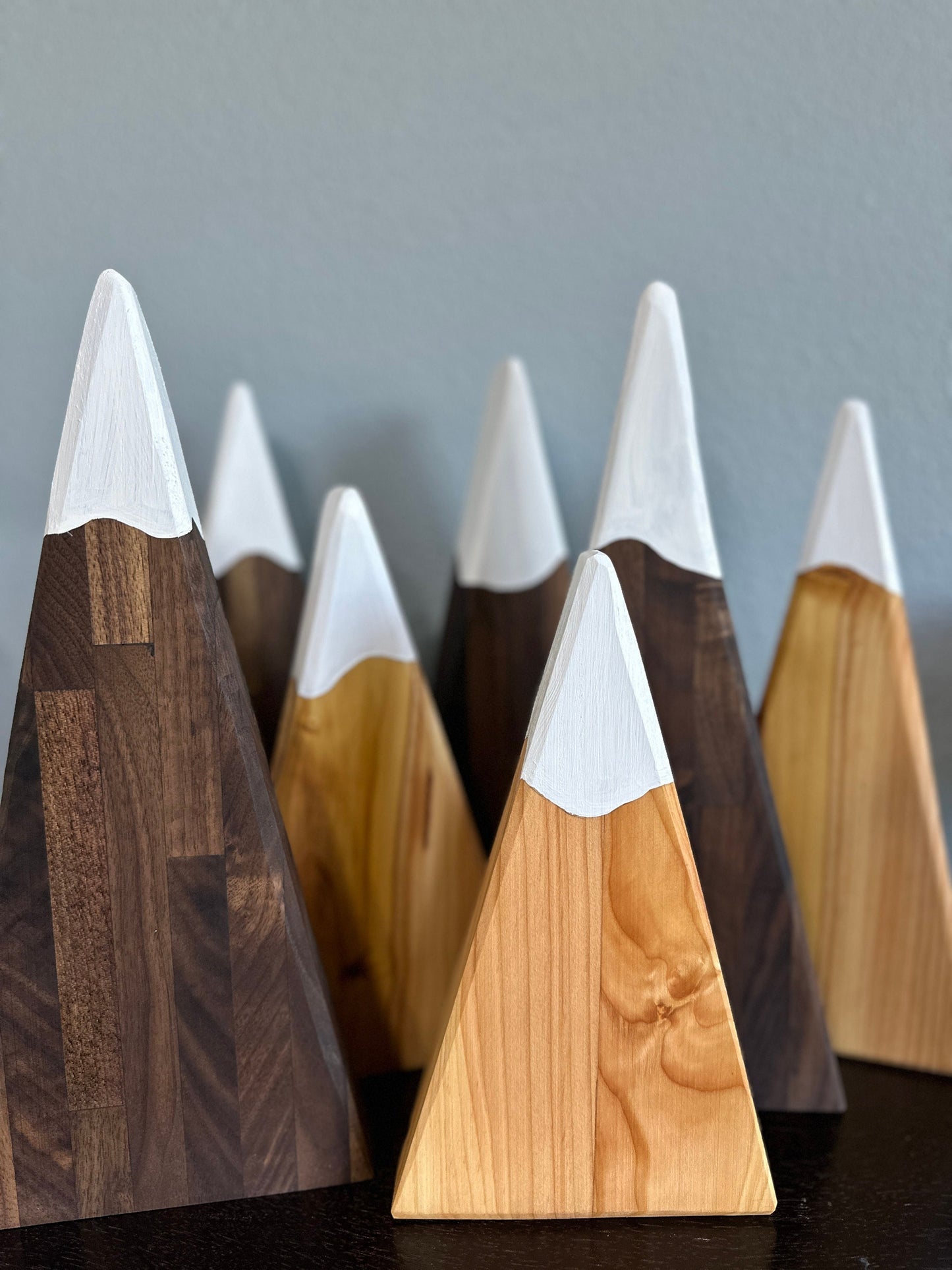 Hardwood triangle cut 3 light and 4 dark mountains with white painted snowcaps