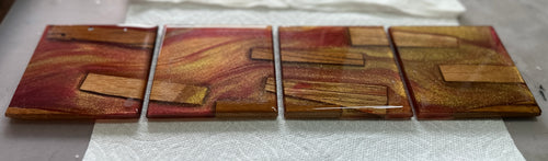 Set of 4 burgundy & gold epoxy coasters with zebra wood pieces
