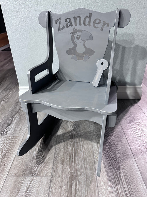 Grey stained rocking chair with Zander name and Toucan engraving