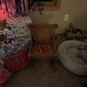 Customer shared picture of Toddler Rocking Chair next to Christmas presents displaying the customization with the name Griffin and a cute buck deer