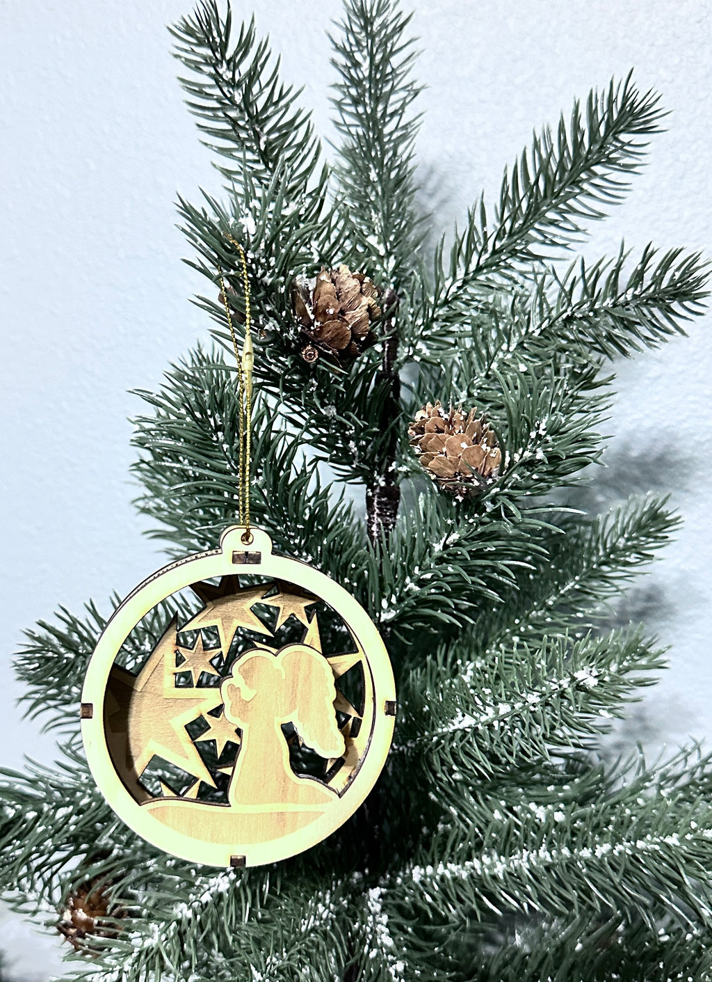 Close up 3d wooden ornament with praying angel.