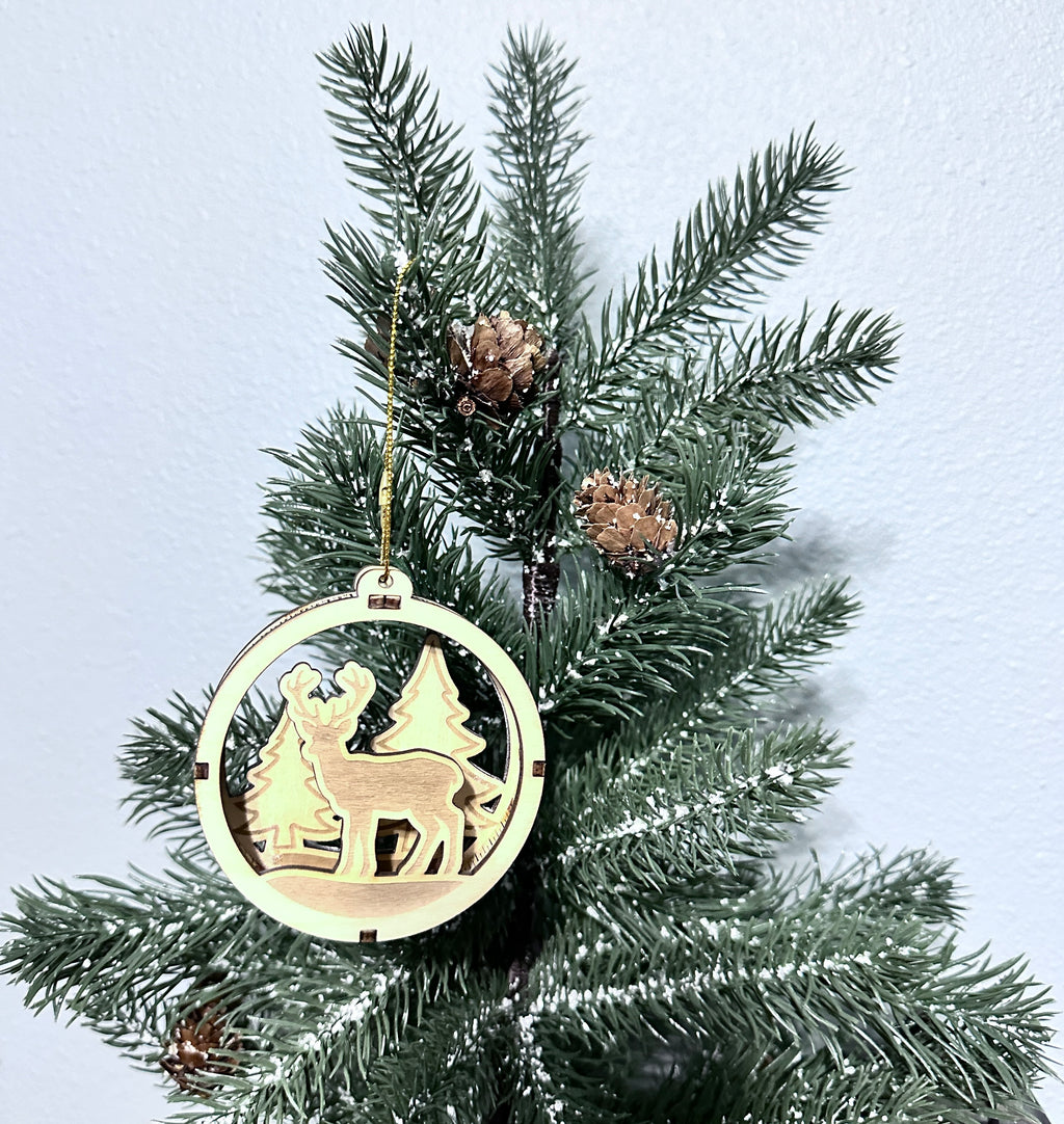 Close up 3d wooden ornament showing deer in the woods.