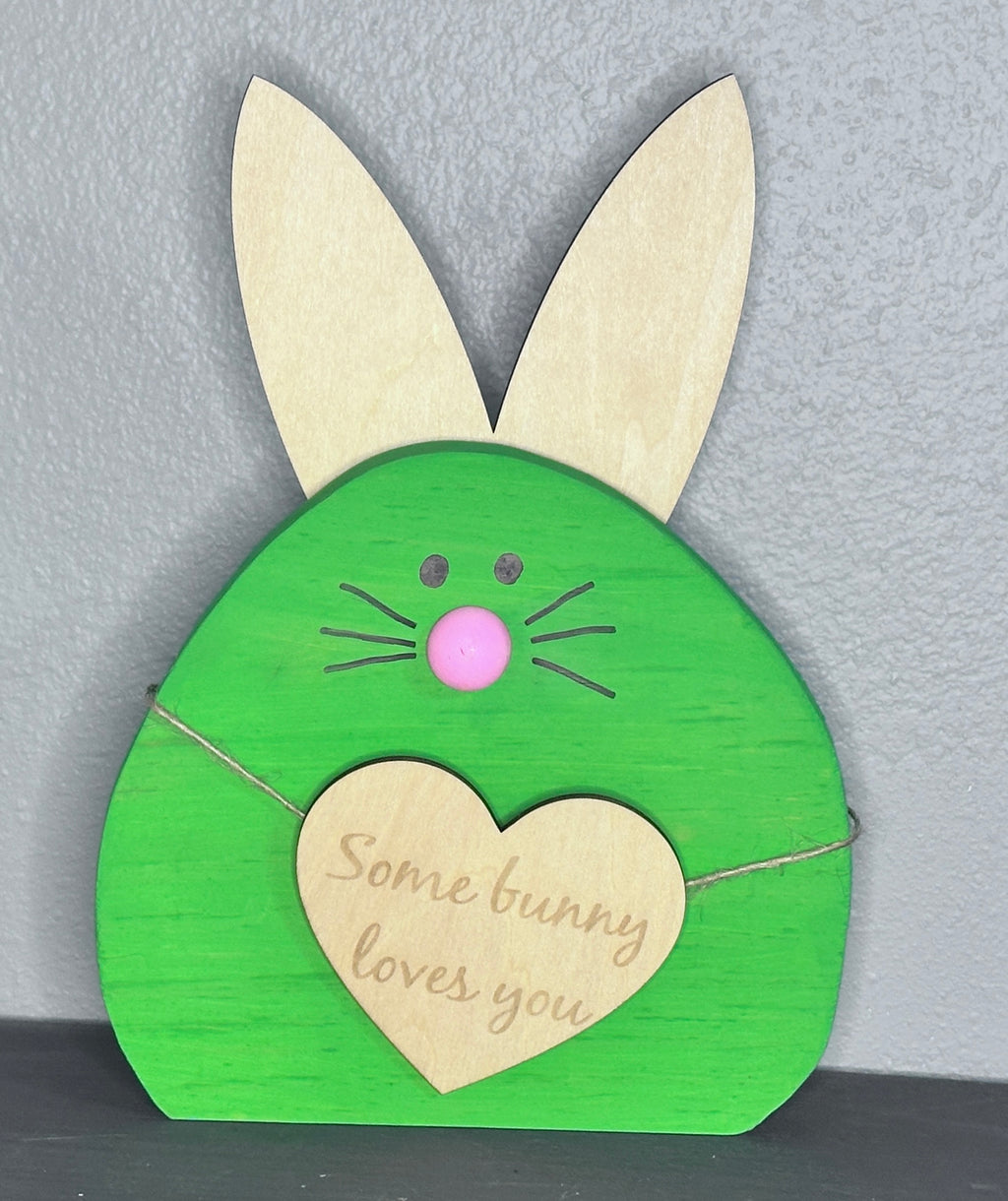 Green painted wooden easter bunny head with light wood ears and heart with cute Easter saying