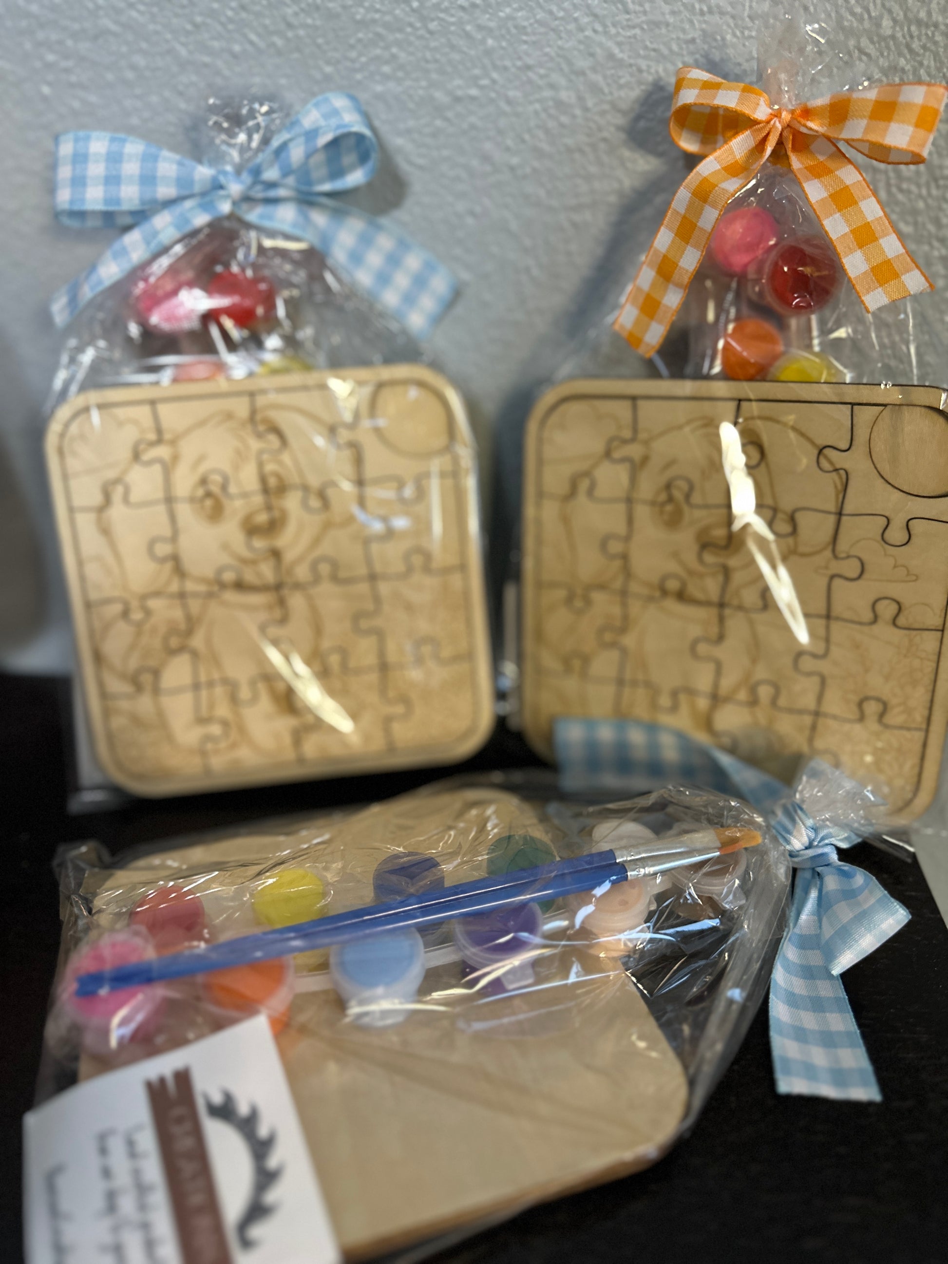 Wooden puzzle 5-inch with paint supplies and ribbons  of cute puppy pre-packaged with checkered ribbon