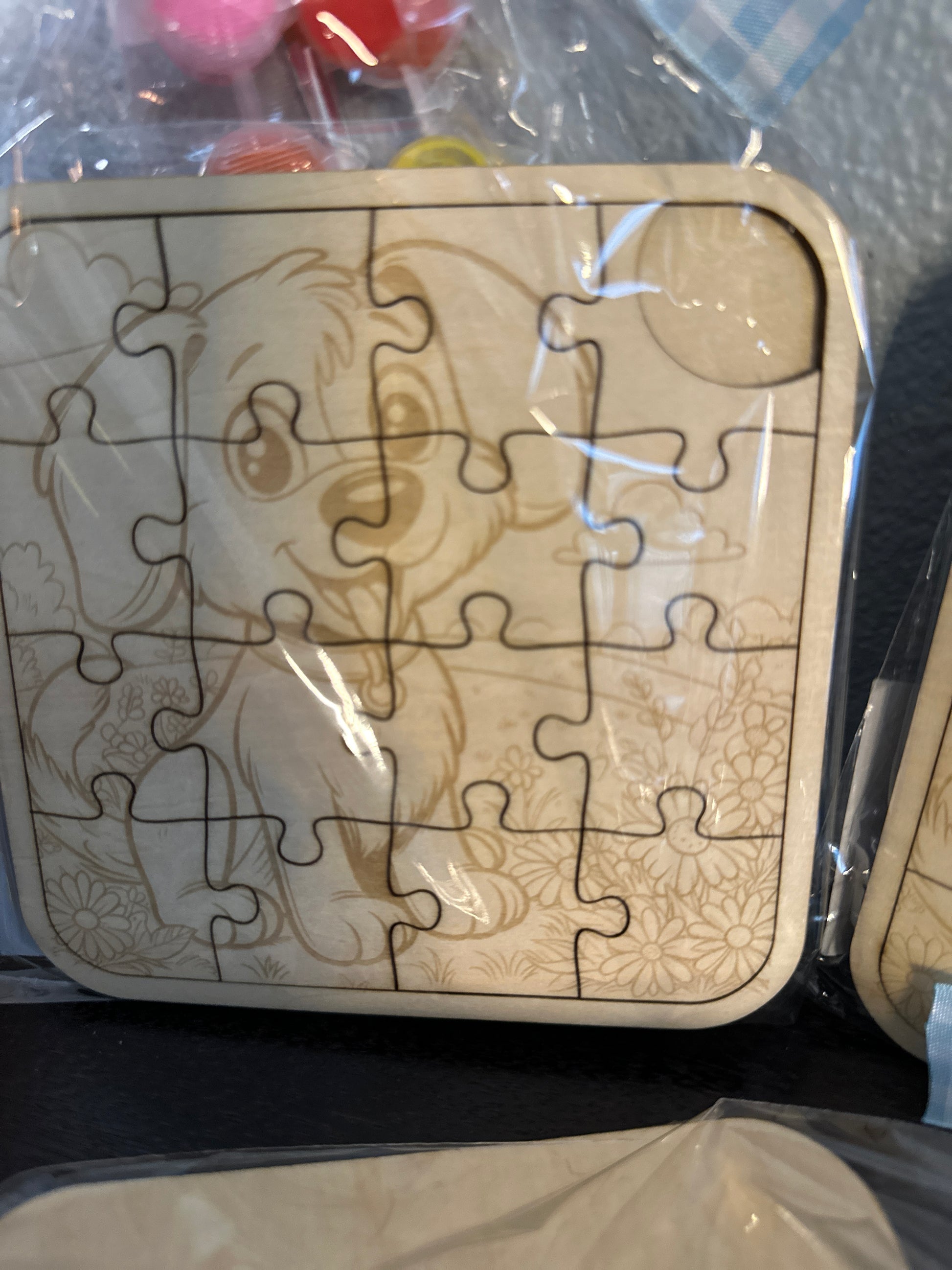 Wooden puzzle 5-inch with paint supplies and ribbons  of cute puppy zoomed in