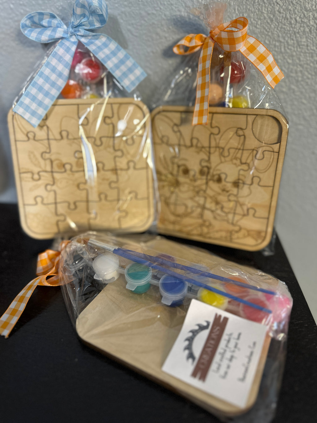 Wooden puzzle 5-inch with paint supplies and ribbons  of cute bunnies pre-packaged clear package with checkered ribbon