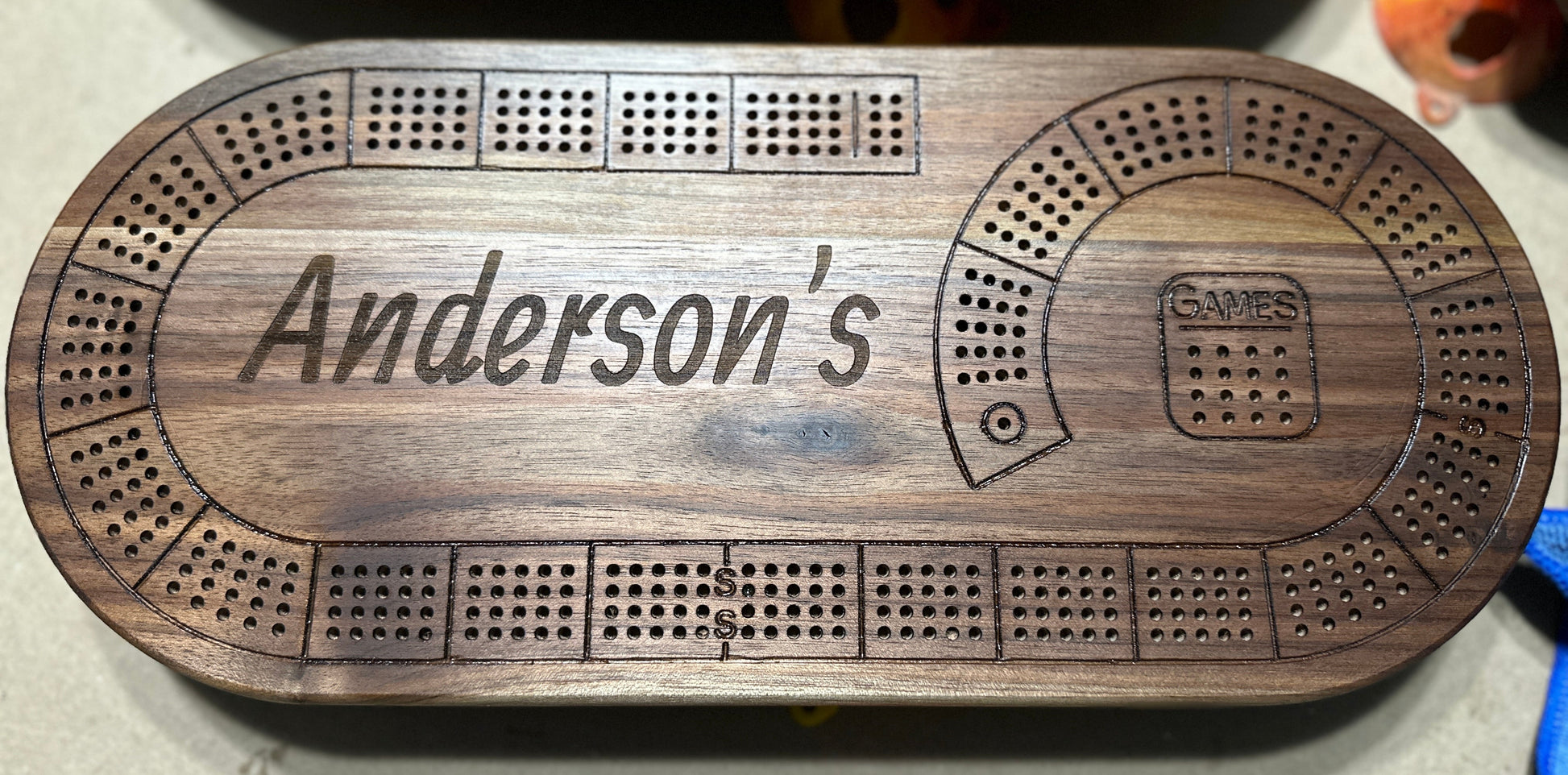 Oval 4 player hardwood cribbage board with Anderson's name engraved