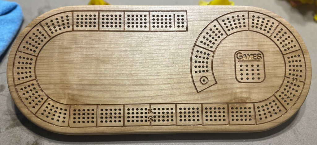 Oval 4 player hardwood cribbage board in maple with no additional engraving