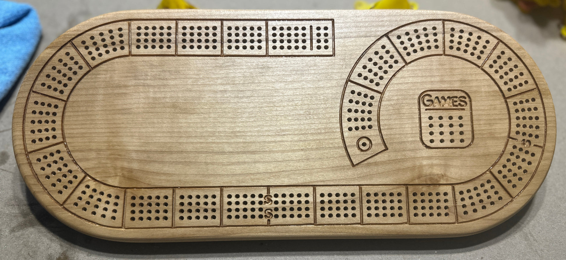 Oval 4 player hardwood cribbage board in maple with no additional engraving