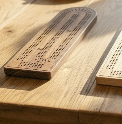 Wooden cribbage board on a wooden surface