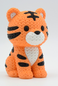 3d printed "knitted" style tiger toy with orange and black stripes on a white background