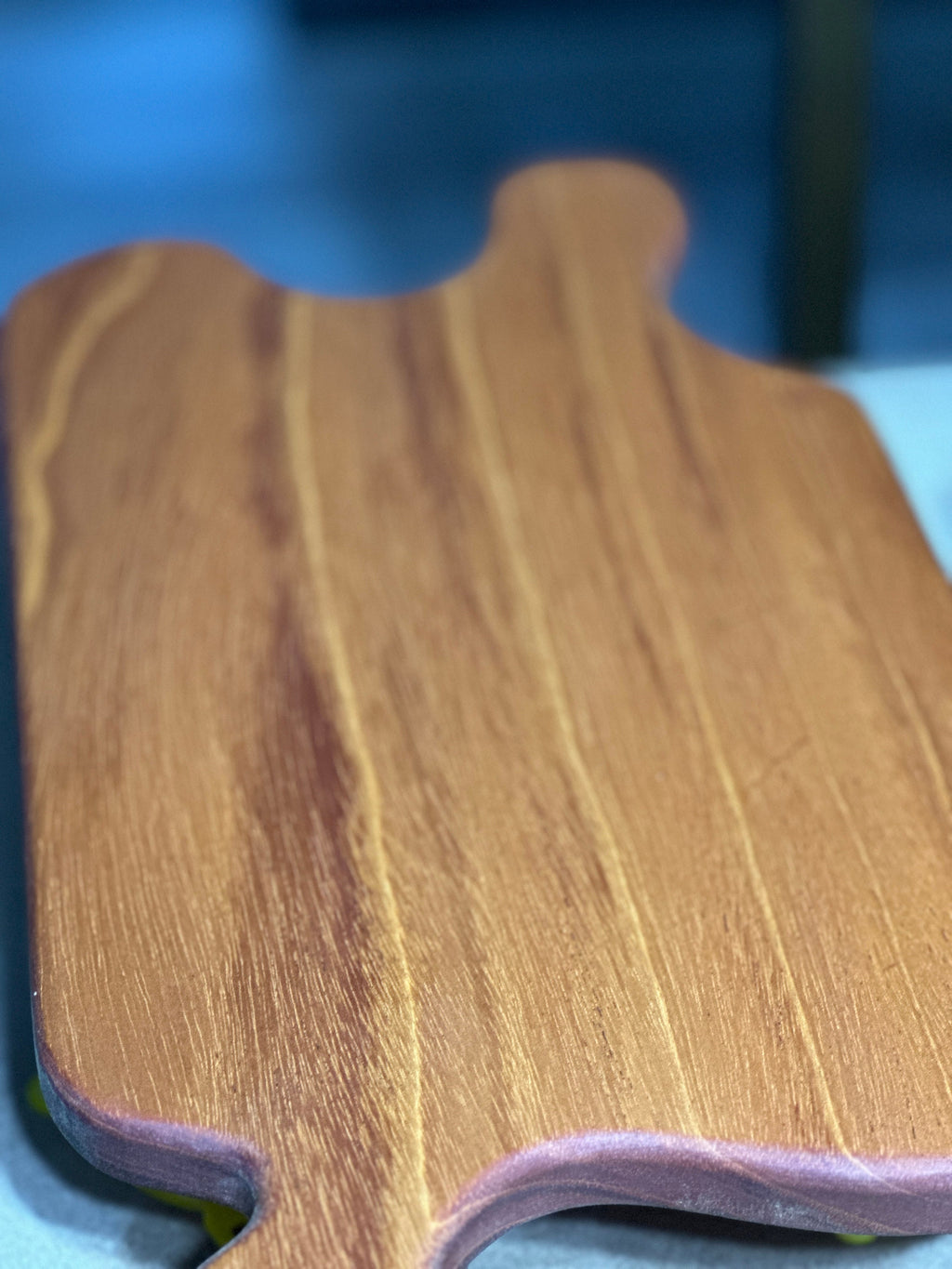 unique wood grain pattern of mahogany jigsaw puzzle shaped charcuterie board