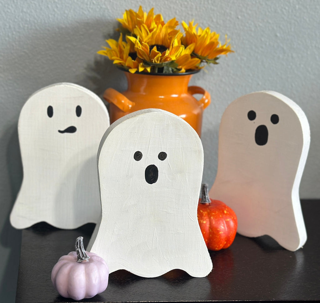 3 wood painted ghosts with orange milk can vase, sunflowers and pumpkin accents