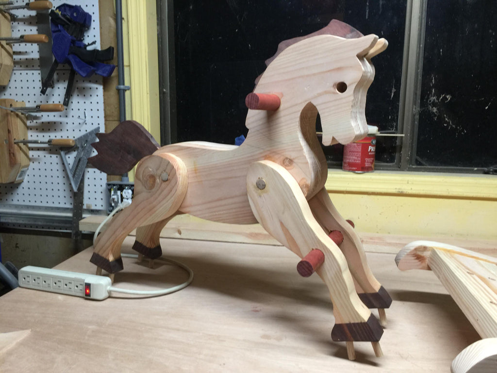 partially assembled custom made antique style wooden rocking horse