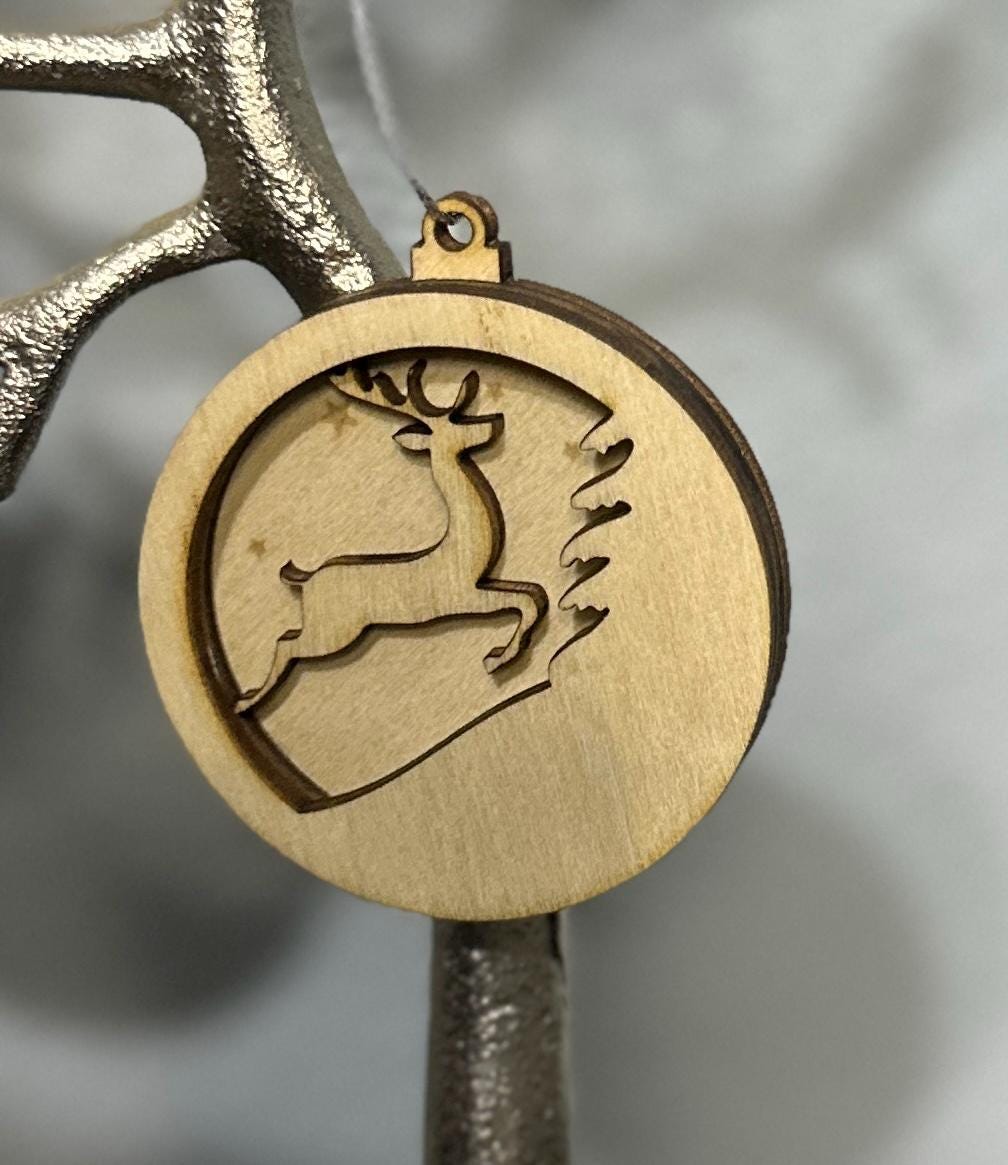 Zoomed in view of stag with tree and stars ornament