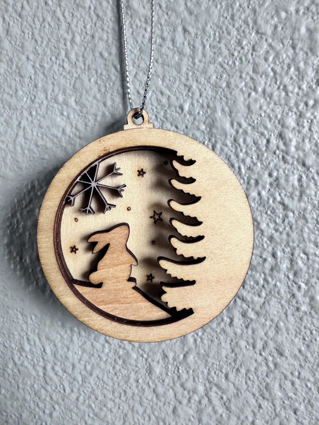 Zoomed in view of Bunny with white snowflake, tree and north star